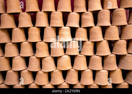 Clay pots stacked on top of each other background or texture Stock Photo