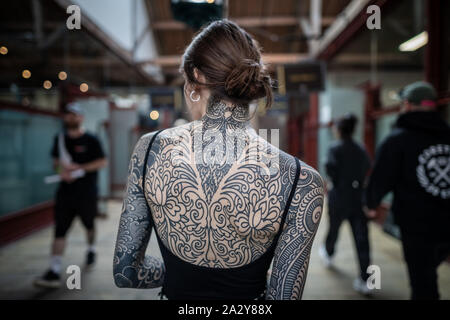 15th International London Tattoo Convention at Tobacco Dock. One of the  most prestigious body art conventions in the world. London, UK Stock Photo 