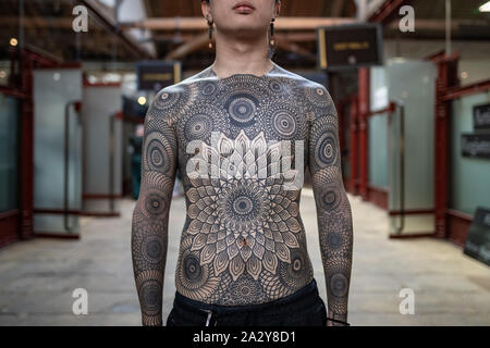 15th International London Tattoo Convention at Tobacco Dock. One of the  most prestigious body art conventions in the world. London, UK Stock Photo 