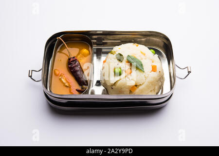 Upma / uppuma sambar in lunch box or tiffin Stock Photo