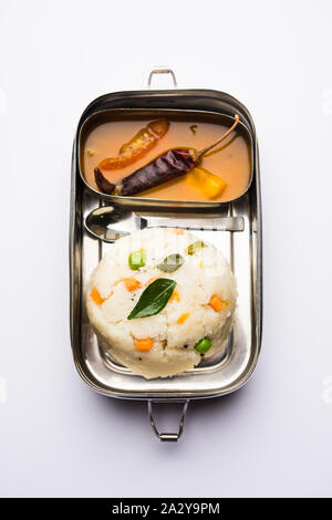 Upma / uppuma sambar in lunch box or tiffin Stock Photo