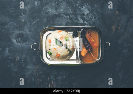 Upma / uppuma sambar in lunch box or tiffin Stock Photo