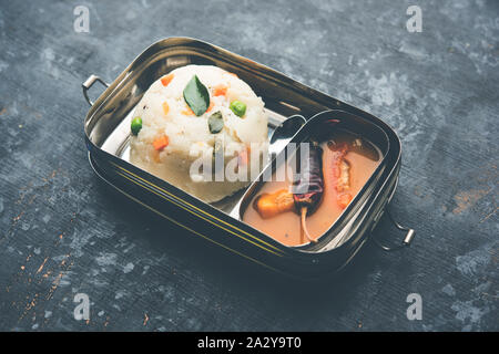 Upma / uppuma sambar in lunch box or tiffin Stock Photo