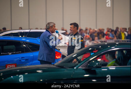 Paul Swift stunt driver, MC'd by Tiff Needell at London Motor Show May 2019, Excel London Stock Photo