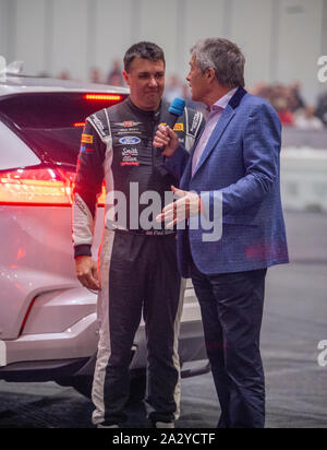 Paul Swift stunt driver, MC'd by Tiff Needell at London Motor Show May 2019, Excel London Stock Photo