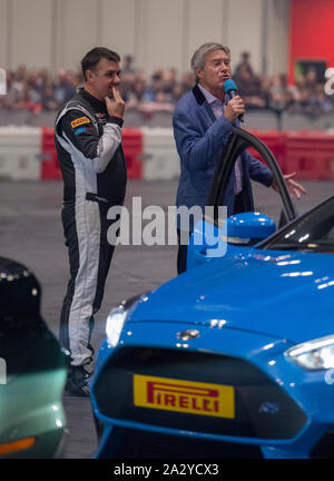 Paul Swift stunt driver, MC'd by Tiff Needell at London Motor Show May 2019, Excel London Stock Photo