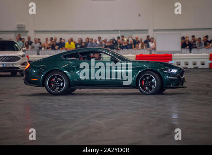 Paul Swift stunt driver, MC'd by Tiff Needell at London Motor Show May 2019, Excel London. Ford Mustang Stock Photo