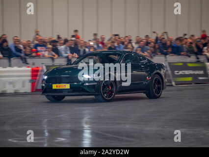 Paul Swift stunt driver, MC'd by Tiff Needell at London Motor Show May 2019, Excel London. Ford Mustang Stock Photo