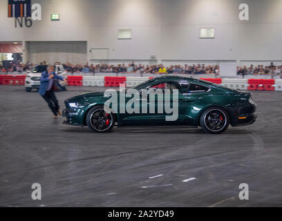 Paul Swift stunt driver, MC'd by Tiff Needell at London Motor Show May 2019, Excel London. Ford Mustang Stock Photo