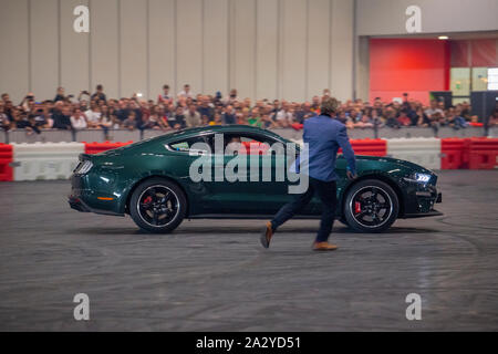 Paul Swift stunt driver, MC'd by Tiff Needell at London Motor Show May 2019, Excel London. Ford Mustang Stock Photo