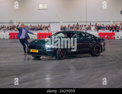 Paul Swift stunt driver, MC'd by Tiff Needell at London Motor Show May 2019, Excel London. Ford Mustang Stock Photo