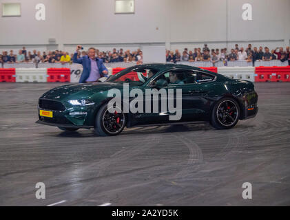 Paul Swift stunt driver, MC'd by Tiff Needell at London Motor Show May 2019, Excel London. Ford Mustang Stock Photo