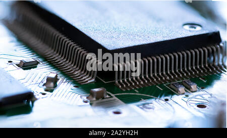 Electronic circuit board close up with processor. Small depth of field. Stock Photo