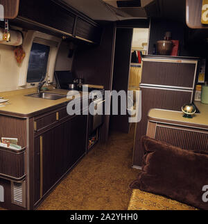 1970s camping. Pictured an American Airstream caravan in aluminium and in the typical 1930s streamline design. The caravan was designed by Hawley Bowlus who was inspirered by the airplane Spirit of St. Louis. Around the world, owners of Airstream caravans meet and this picture was taken in Sweden on September 21 1971. Stock Photo