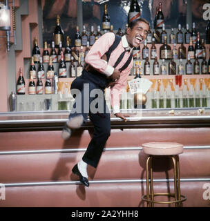 Sammy Davis Jr. 1925-1990. American singer, musician, dancer, actor. Pictured here when recording a televison show 1963 Stock Photo