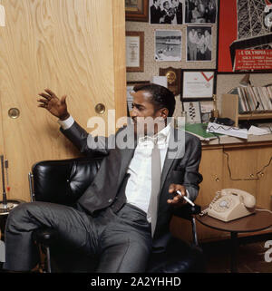 Sammy Davis Jr. 1925-1990. American singer, musician, dancer, actor. Pictured here in his office 1963 Stock Photo