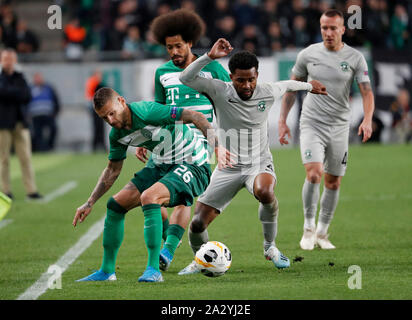 BUDAPEST, HUNGARY - JUNE 20: (r-l) Isael da Silva Barbosa of Ferencvarosi TC  challenges Dzenan Burekovic of Ujpest FC during the Hungarian OTP Bank Liga  match between Ferencvarosi TC and Ujpest FC