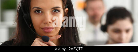 Three call centre service operators at work Stock Photo