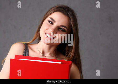 woman holding folder in hand Stock Photo