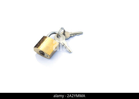 keys lies next to a padlock isolate on a white background Stock Photo