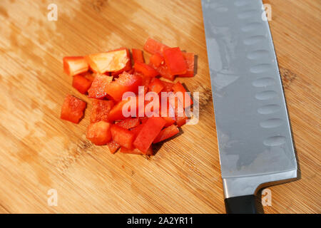 Cut up Veggies, red peppers on a cutting board Stock Photo
