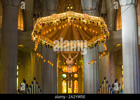 Barcelona, Catalonia, Spain - November 19, 2018: The crucifix in the beautiful interior of the Temple Expiatori de la Sagrada Familia (Expiatory Churc Stock Photo