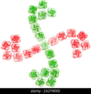 hard candy in the shape of lauburu, Basque cross, arranged in the same shape, isolated on white background Stock Photo