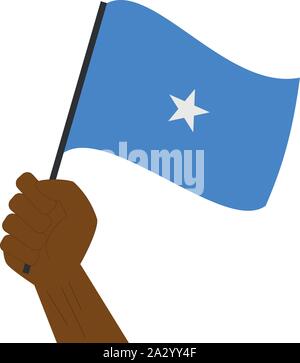 Hand holding and raising the national flag of Somalia Stock Vector
