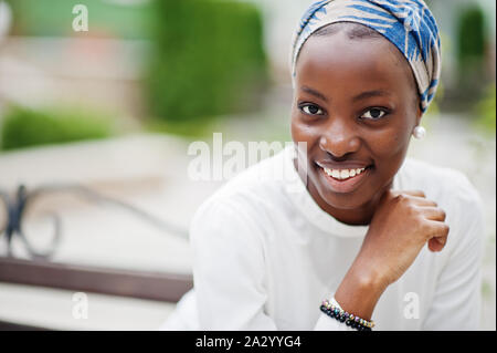 Young modern fashionable, attractive, tall and slim african muslim woman in hijab or turban head scarf posed. Stock Photo