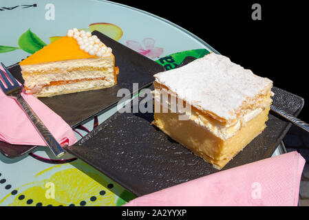 Traditional Kremšnita (Bled custard dessert) cakes on plate, Old Town, Ljubljana, Slovenia Stock Photo