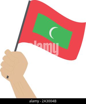 Hand holding and raising the national flag of Maldives Stock Vector