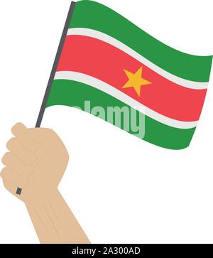 Hand holding and raising the national flag of Suriname Stock Vector