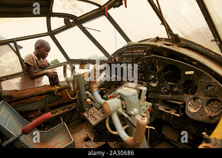Central African Republic CAR Bangui Children playing in the cockpit of an old airplane  Photo Jaco Klamer 26-05-2014 Stock Photo