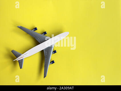 Model plane on pastel color background. Toy airplane. Travel concept. Illustration of plane . Stock Photo