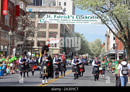 Band in traditional Celtic clothing playing music in St. Patrick's Day parade in Roanoke, VA, USA Stock Photo