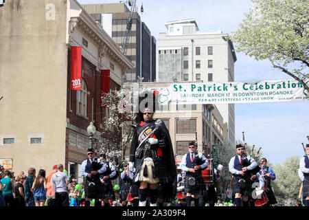 Band in traditional Celtic clothing playing music in St. Patrick's Day parade in Roanoke, VA, USA Stock Photo