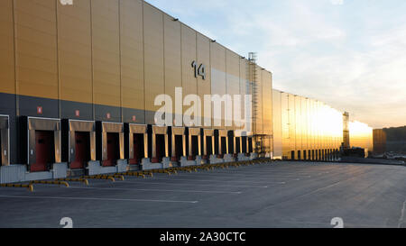 October 3, 2019 - Moscow, Russia: Modern warehouse complex. View of loading docks in the rays of the rising sun Stock Photo