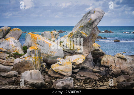 The pink granite rocks with strange shapes, coast in Brittany. The mass of enormous pink rocks, the pink granite, rock with strange shapes. Brittany ( Stock Photo