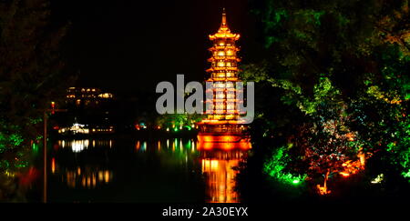 Sun pagoda of Guilin floating on lake at night, China Stock Photo