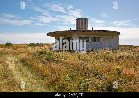 Disused concrete navigation building located in the former WW II German Concentration camp SS Lager Sylt on the island of Alderney, Channel Islands Stock Photo