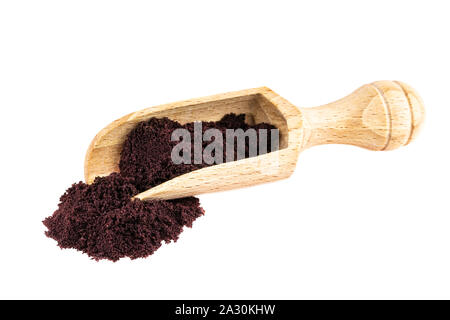 Acai powder. Acai palm fruit berry powder in wooden scop isolated on white Stock Photo