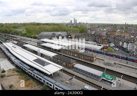 High level view of Finsbury Park station, north London, UK. Shows Thameslink and Great Northern trains. New tower blocks in Tottenham on the horrizon. Stock Photo