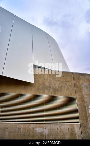 Abstract fragment of modern architecture with metal and concrete walls. Stock Photo