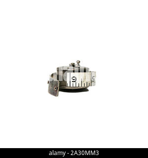 Antique measuring tape in a silver holder Stock Photo