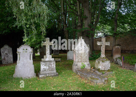 Algae-Covered Historic or Old Tombstones in Graveyard or Cemetery of Holy Trinity Church, aka Shakespeare's Church, Stratford-upon-Avon Stock Photo