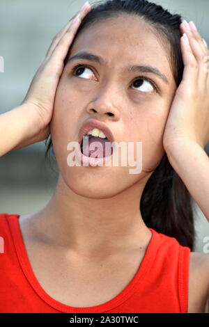 An Anxious Youthful Asian Person Stock Photo