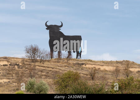 Osborne Bull sign - a black silhouetted image of a bull seen by the sides of roads in Spain - this one is in La Rioja next to the N-232 Stock Photo