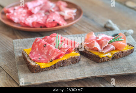 Spanish sandwiches with salchichon anb jamon close-up Stock Photo