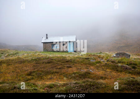 Hutchison Memorial Hut bothy on Glen Derry route in the Cairngorms National Park that takes you up to Ben Macdui the highest mountain in the park. Stock Photo