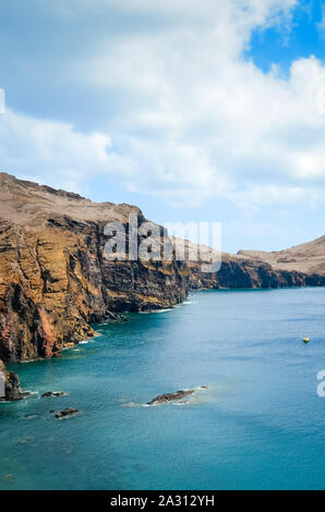Volcanic cliffs in Ponta de Sao Lourenco, the easternmost point of Madeira Island, Portugal. Amazing rocks by the Atlantic ocean. Portuguese volcanic landscape. Travel spot and tourist attraction. Stock Photo